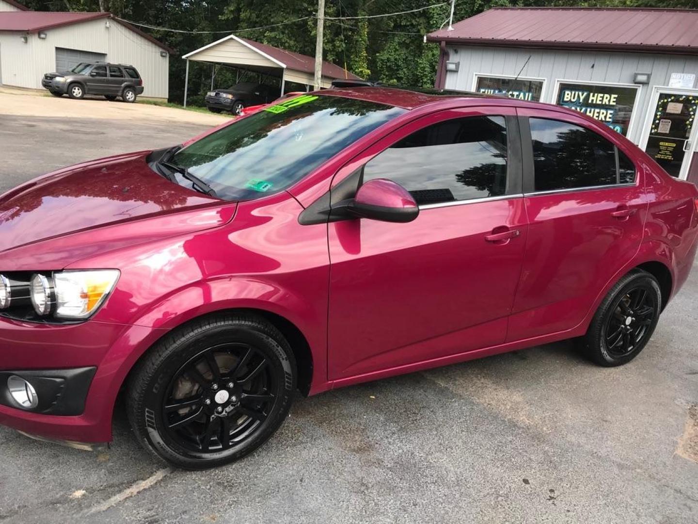 2014 PINK CHEVROLET SONIC LT AUTO (1G1JC5SH9E4) with an 1.8L engine, Automatic transmission, located at 3338 US Rt. 60 East, Huntington, WV, 25705, (304) 733-9888, 38.411072, -82.379471 - Photo#1