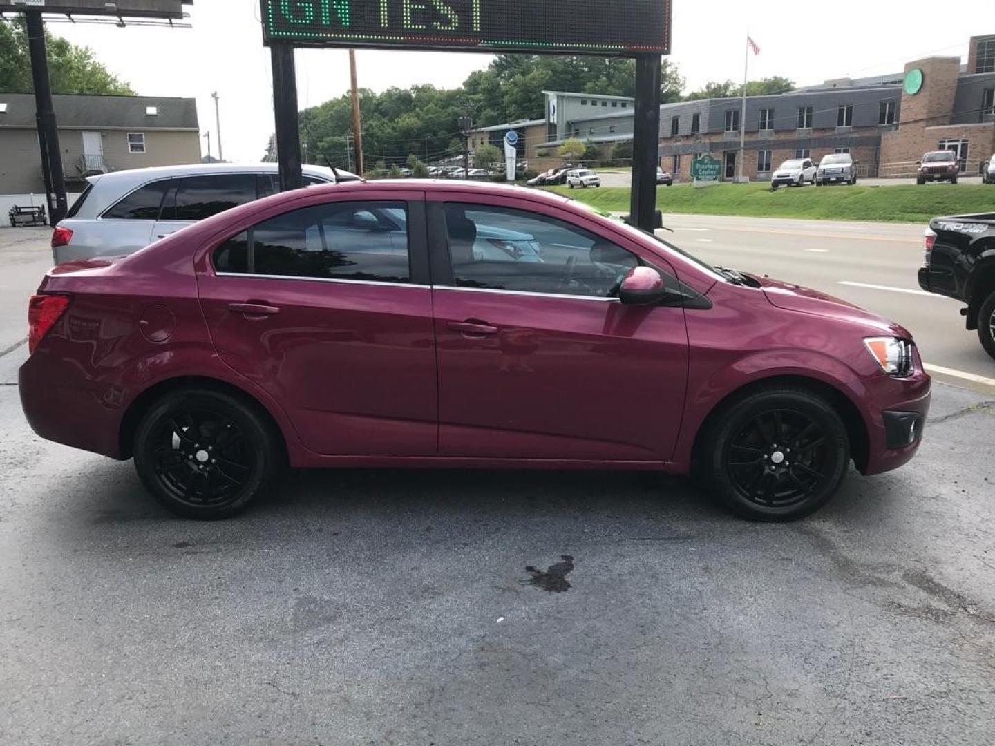 2014 PINK CHEVROLET SONIC LT AUTO (1G1JC5SH9E4) with an 1.8L engine, Automatic transmission, located at 3338 US Rt. 60 East, Huntington, WV, 25705, (304) 733-9888, 38.411072, -82.379471 - Photo#0